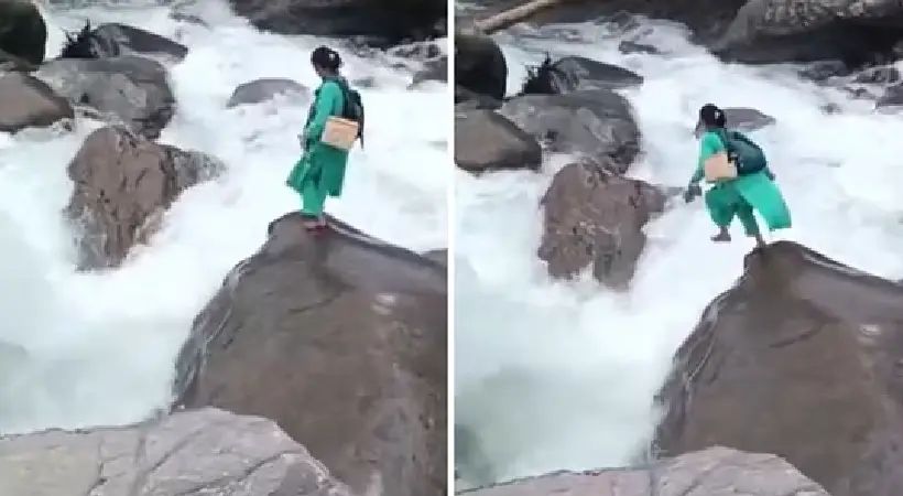 നവജാത ശിശുവിന് പ്രതിരോധ കുത്തിവയ്പ്പ് നല്കുന്നതിനായി കരകവിഞ്ഞൊഴുകുന്ന നദി ചാടിക്കടന്ന് നഴ്സ്: വൈറലായി വീഡിയോ