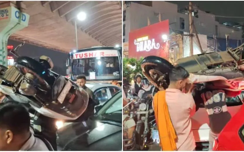 ട്രാഫിക് ബ്ലോക്കില്‍നിന്ന് രക്ഷപ്പെടാൻ വേറെ വഴിയില്ല; സ്‌കൂട്ടര്‍ തോളിലേറ്റി യുവാക്കള്‍